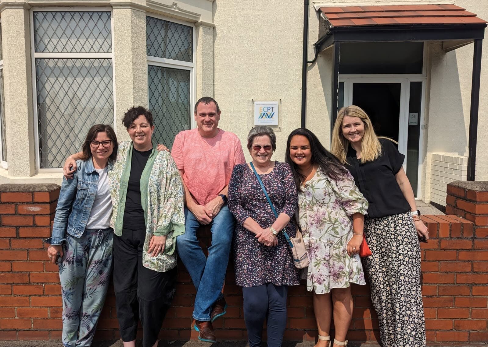 TALKINGWORKS members together outside
